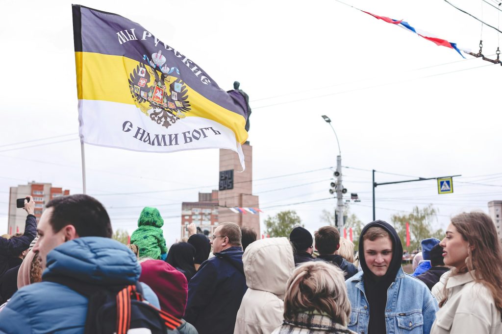 People celebrating Victory Day, spectators of the solemn parade of the Russian armed forces.